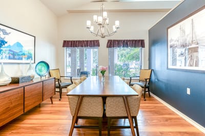 Bright and inviting common area with a dining table