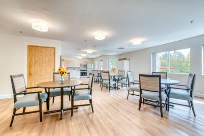 Bright dining room with tables and chairs