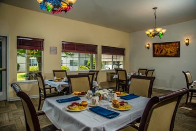 Dining area with tables set for a meal