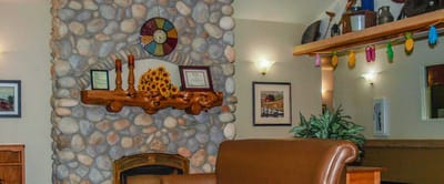 Cozy common area with stone fireplace and decorations