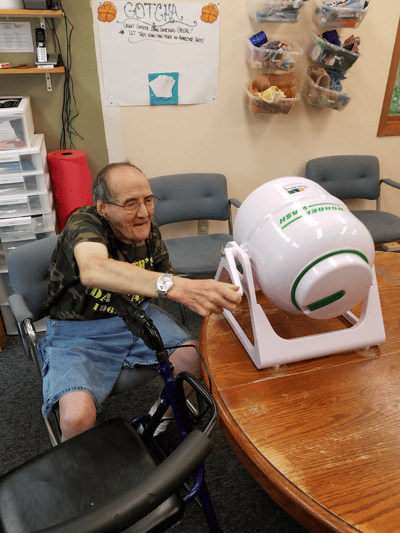 Resident engaging with an activity in an interior space