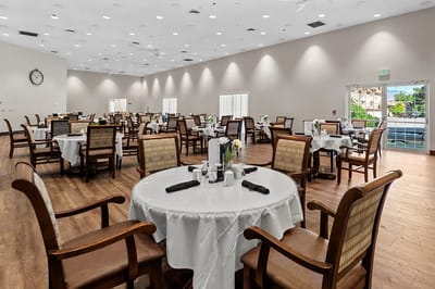 Spacious dining room with tables set for meals