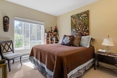 Cozy resident room with a bed and artwork