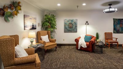 Comfortable lounge area with cozy seating and art