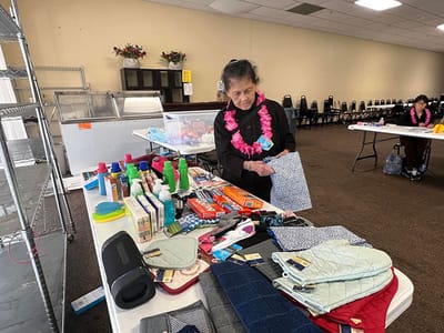 Resident participating in an activity with various items on a table