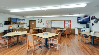Bright common area with tables and chairs