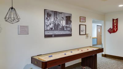 Shuffleboard table in a common area of the facility