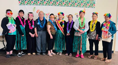 Residents celebrating in colorful attire at an activity event