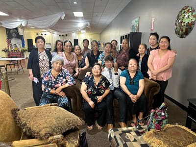 Group of residents posing together in a common area
