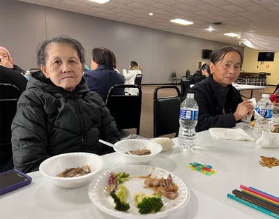 Residents enjoying a meal together in a dining area