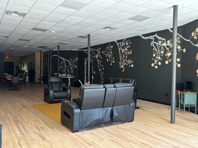 Bright common area with modern seating and décor