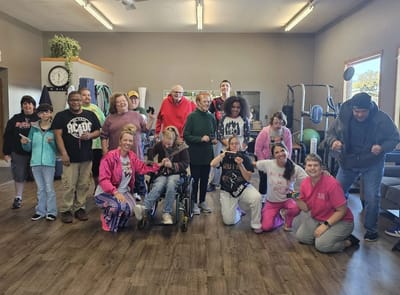 Residents and staff engaging in group activity indoors