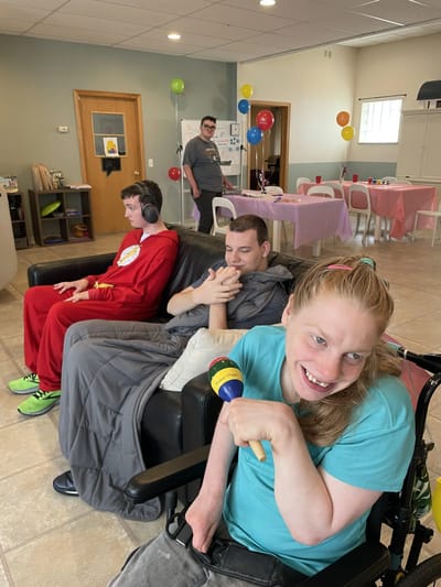 Residents enjoying activities in a common area.