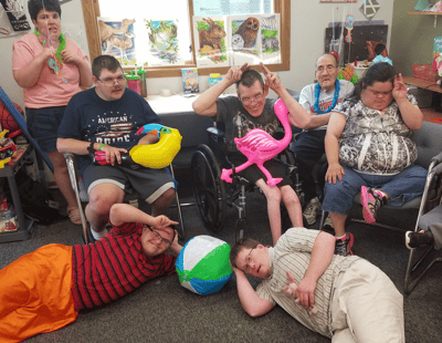 Residents engaging in fun activities with props