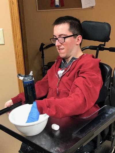 Resident participating in a hands-on activity