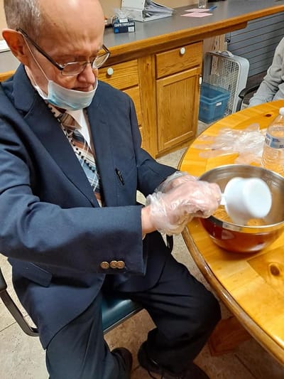 Resident preparing food during an activity session