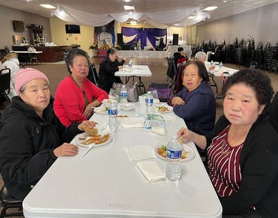 Residents enjoying a meal together in a dining area