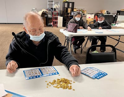 Residents enjoying a game of bingo indoors
