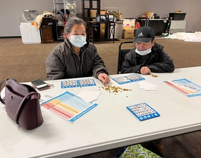 Residents playing bingo in a common area