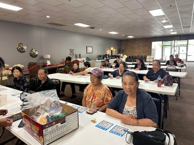 Residents participating in a bingo game in a common area