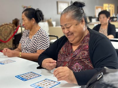 Residents enjoying a bingo game in an activity room