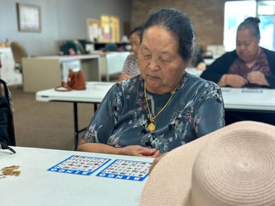 Resident playing bingo in a common activity area