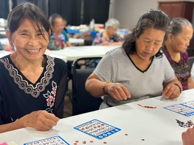 Residents enjoying a game of bingo in an activity room