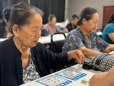 Residents playing bingo in an activity room