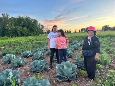 Residents and children in a vegetable garden