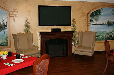 Cozy common area with cozy chairs and a fireplace