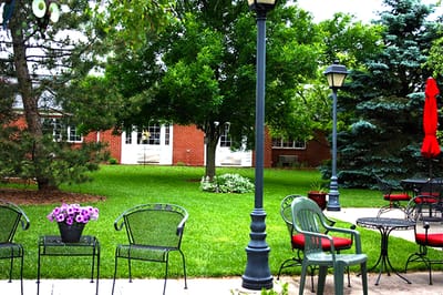 Outdoor seating area with tables and chairs