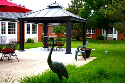 Outdoor seating area with gazebo in the facility garden