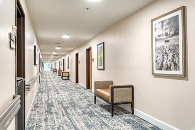 Bright hallway with seating and artwork