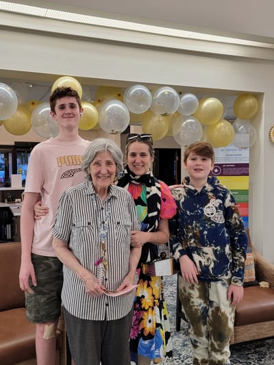 Residents and family members celebrating in a common area