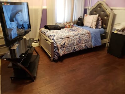 Cozy private room with a bed and television
