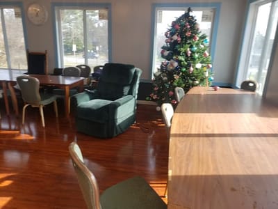 Brightly lit common area with festive decorations