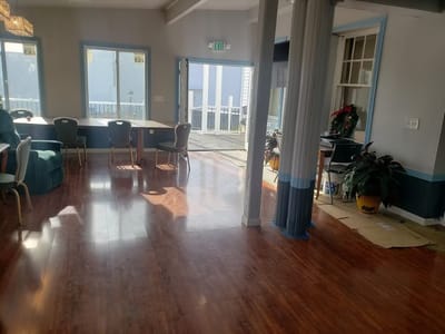 Bright interior common area with seating and windows