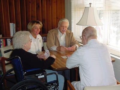 Residents playing cards in a communal area
