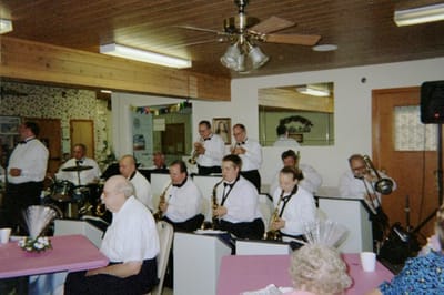 Residents enjoying live music performance in a common area