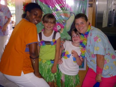 Staff and children celebrating in a decorated area
