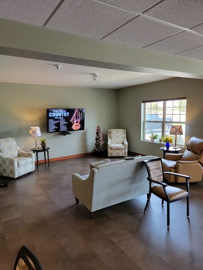Common area with seating and television