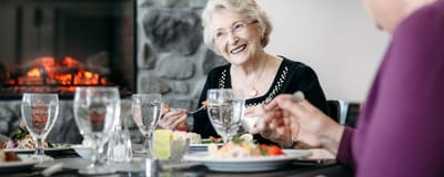 Residents enjoying a meal in the dining room