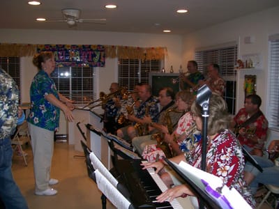 Residents and staff enjoying a live band in a common area