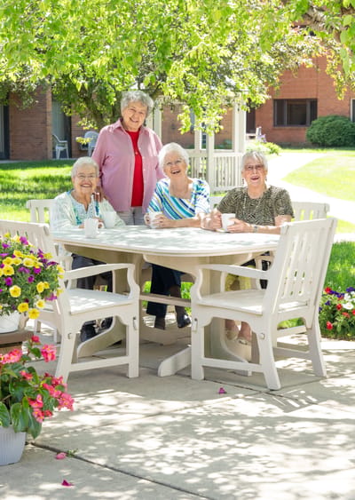 Residents enjoying coffee in an outdoor area