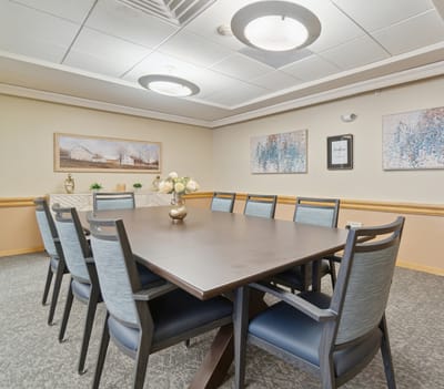 Brightly lit interior dining area with a large table