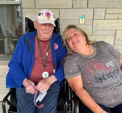 Resident and staff member enjoying time outdoors