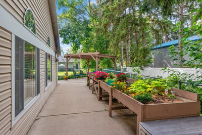 Outdoor garden area with vibrant flower boxes