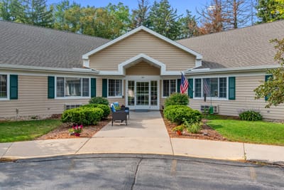 Front entrance of LakeHouse Lake Mills with outdoor seating