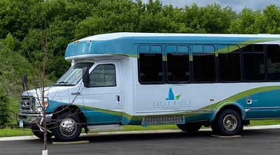 Facility transport bus with logo