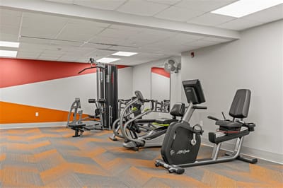 Interior view of a fitness room with exercise equipment